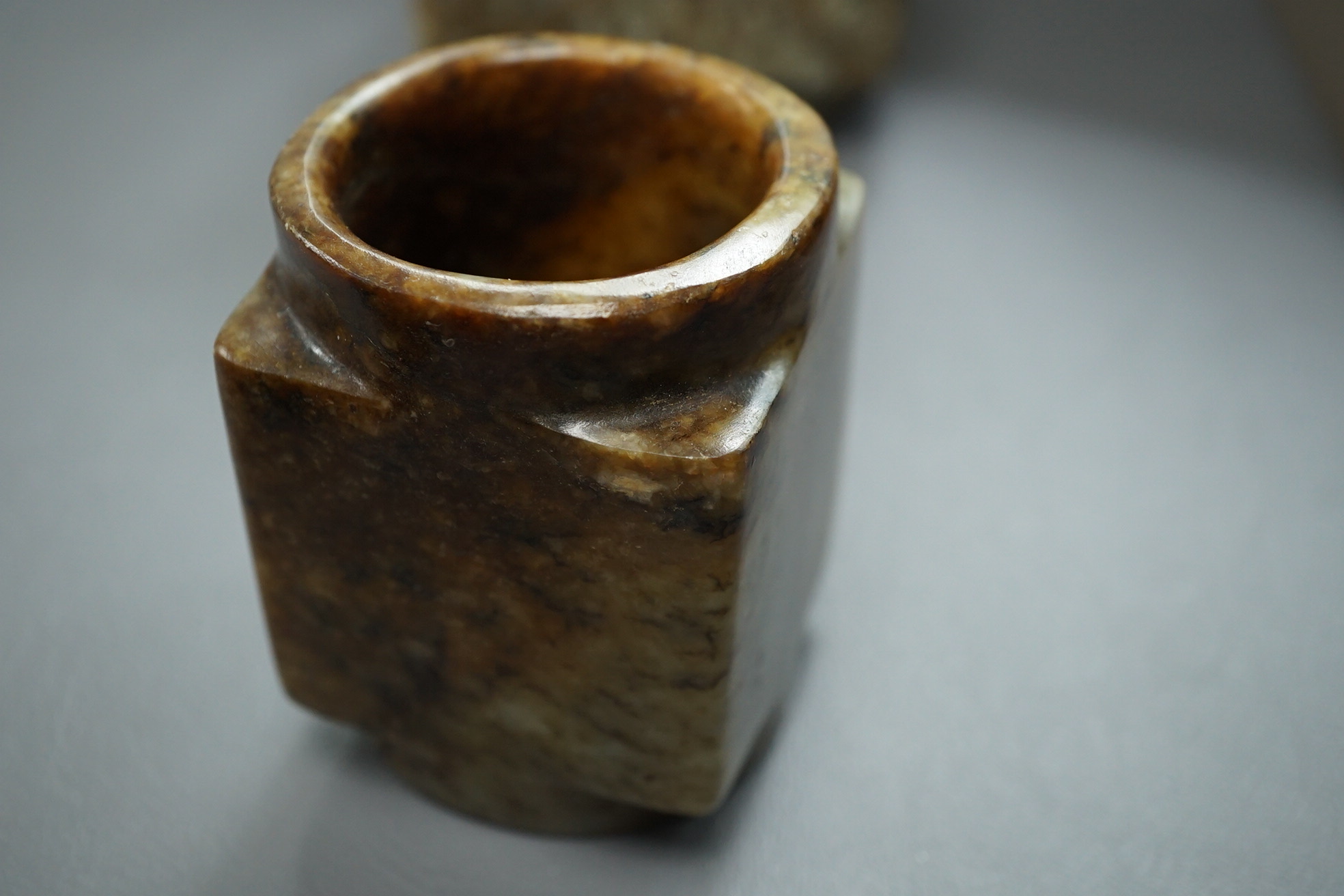 Four Chinese archaistic jade or hardstone cong